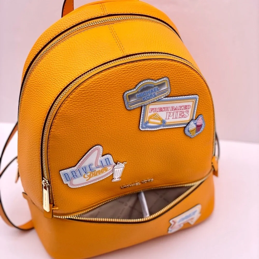 Michael Kors Vibrant Orange Backpack with Fun Patches